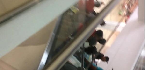  ass under pink skirt on an escalator.MOV